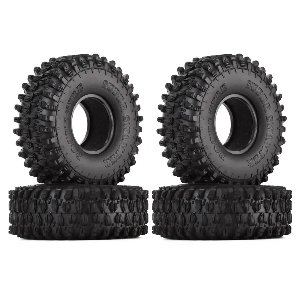 Black rubber off-road tires with aggressive tread patterns and ’super slick’ branding.