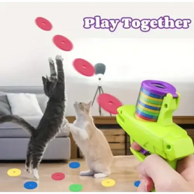 Bright green plastic toy gun with a rainbow-colored spiral magazine.