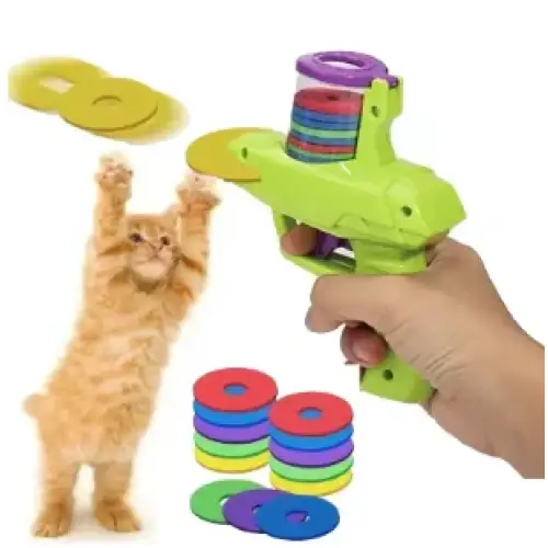 Green plastic toy gun with colorful circular targets.