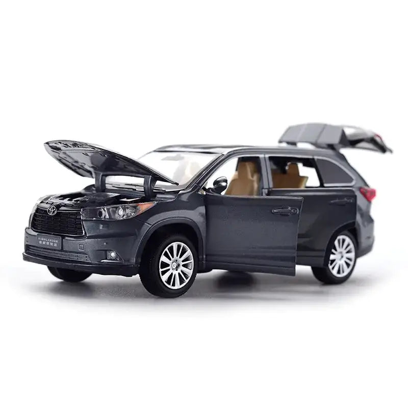 Dark gray metallic toy suv with open hood and rear gate, featuring detailed silver rims and tan interior seats.