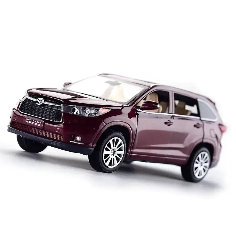 Maroon metallic toyota highlander suv model toy with detailed chrome wheels and grille.
