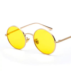 Gold-rimmed round sunglasses with vibrant yellow lenses.
