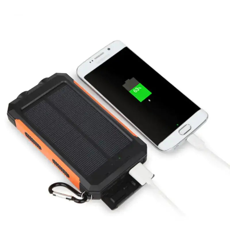 Black and orange solar-powered portable charger with a rugged design, featuring a built-in carabiner for easy attachment.