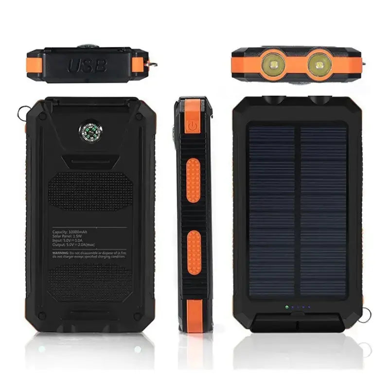 Black and orange rugged solar-powered portable charger with dual led lights, a built-in compass, and textured grip panels.