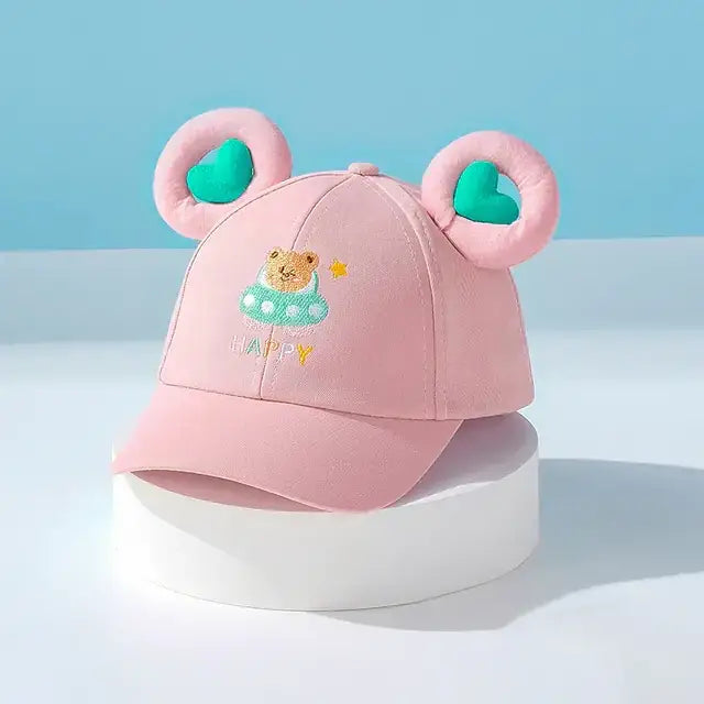 Pink baseball cap with plush bear ears and a embroidered teddy bear design.