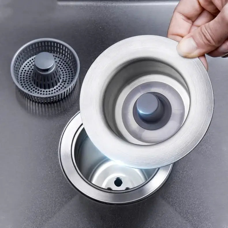 Stainless steel sink strainer with a brushed finish and perforated design.