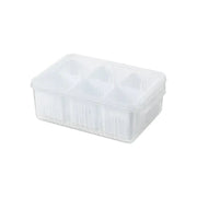 Clear plastic egg storage container with six compartments.
