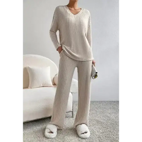 Cream-colored ribbed knit pajama set with long sleeves and wide-leg pants.