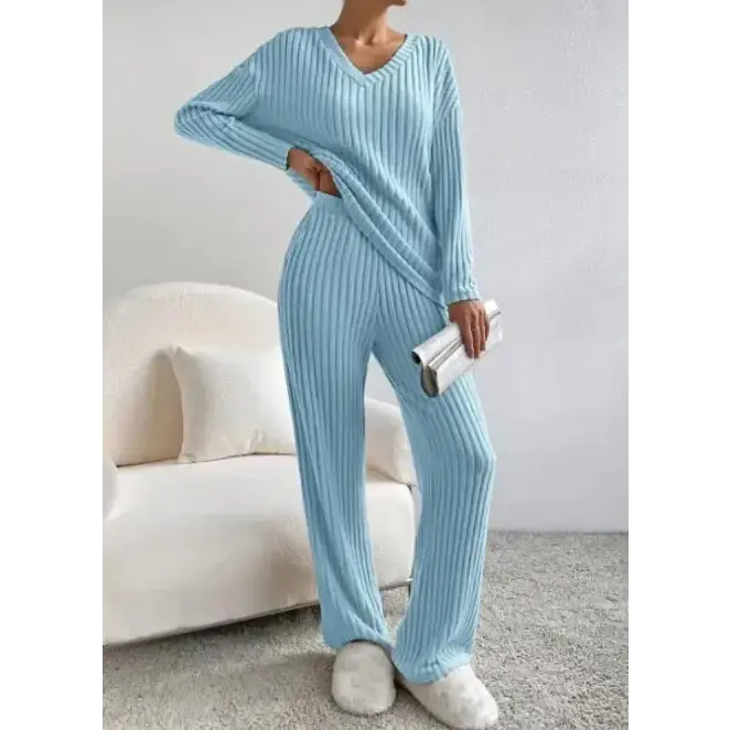 Light blue ribbed knit pajama set with a v-neck top and matching wide-leg pants.