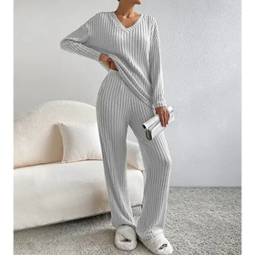 A cozy, light gray ribbed knit pajama set with a v-neck top and matching wide-leg pants.