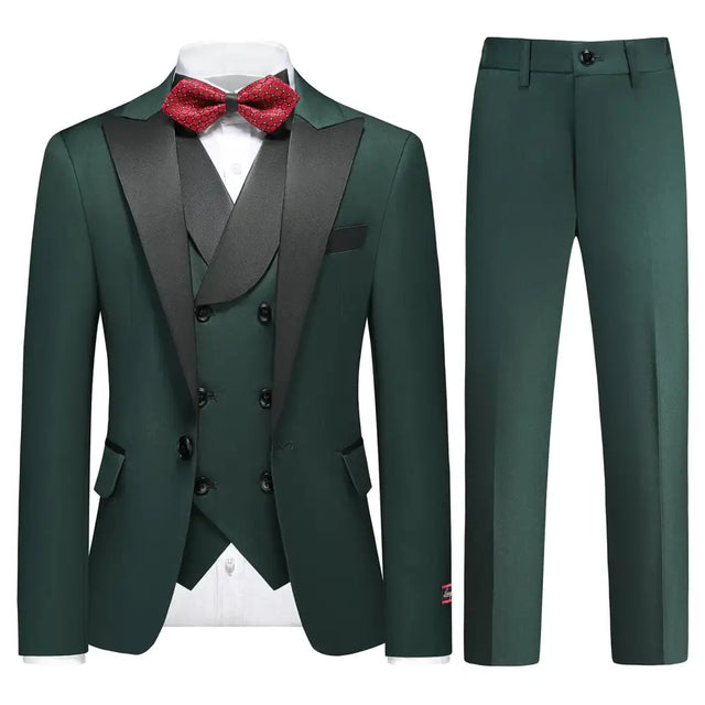 Elegant dark green tuxedo suit with black satin lapels and matching vest, accented by a red polka-dot bow tie.