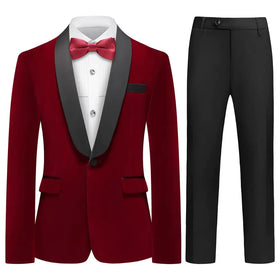 Elegant burgundy tuxedo jacket with black satin lapels and matching trousers, featuring a crisp white shirt and red bow tie.