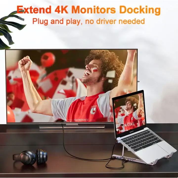 Black and silver 4k monitor docking station with multiple ports for seamless laptop connectivity.