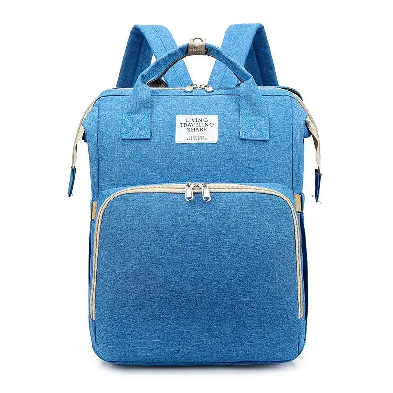 Blue textured fabric backpack with beige zipper pulls and a white label reading ’living traveling share’.