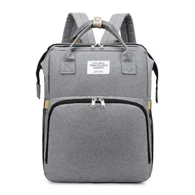 Gray textured fabric backpack with black zipper accents and beige trim details.