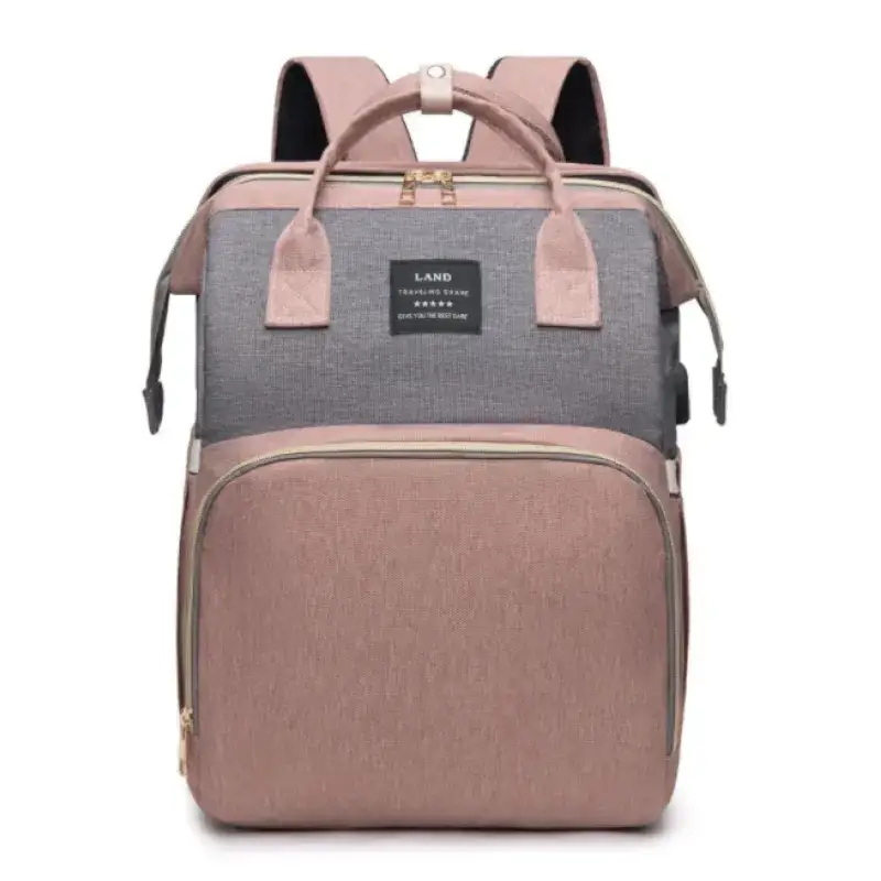 A two-tone pink and gray fabric backpack with gold zippers, featuring a front pocket and top handles.