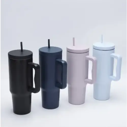 Black, navy blue, blush pink and light blue insulated travel mugs with handles and lids.