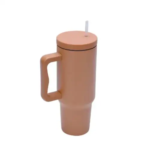 Tan insulated tumbler with a matching lid and handle, featuring a white straw.