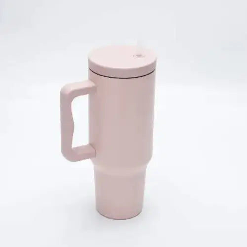 Pink insulated travel mug with a matching lid and integrated handle.