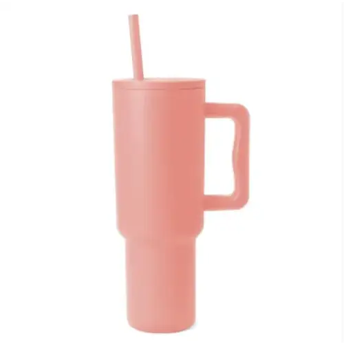 Pink insulated tumbler with a handle and straw.