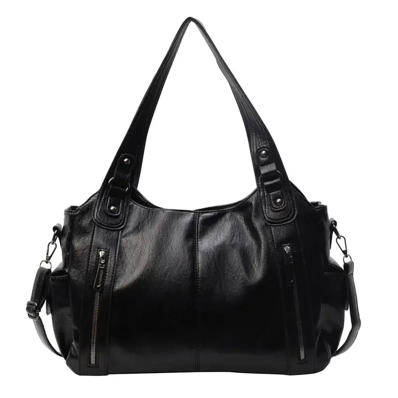 Black faux leather shoulder bag with two zipped side pockets and a detachable strap.