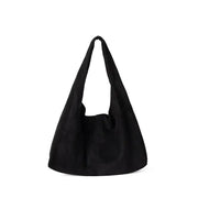 Black suede hobo bag with a soft, slouchy silhouette and wide shoulder strap.