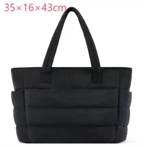 Black quilted tote bag with sturdy handles and a structured, padded design.
