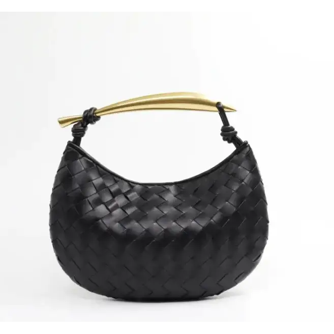 Black woven leather handbag with a gold-tone handle.