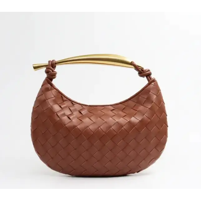 Brown woven leather handbag with a gold-tone handle.