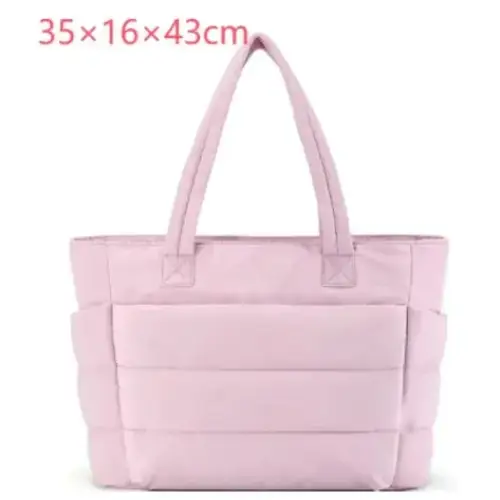 Pink quilted tote bag with structured handles and a sleek, modern design.