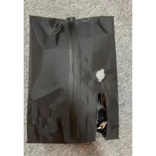 Black zippered pouch with a small white button and a visible zipper pull.