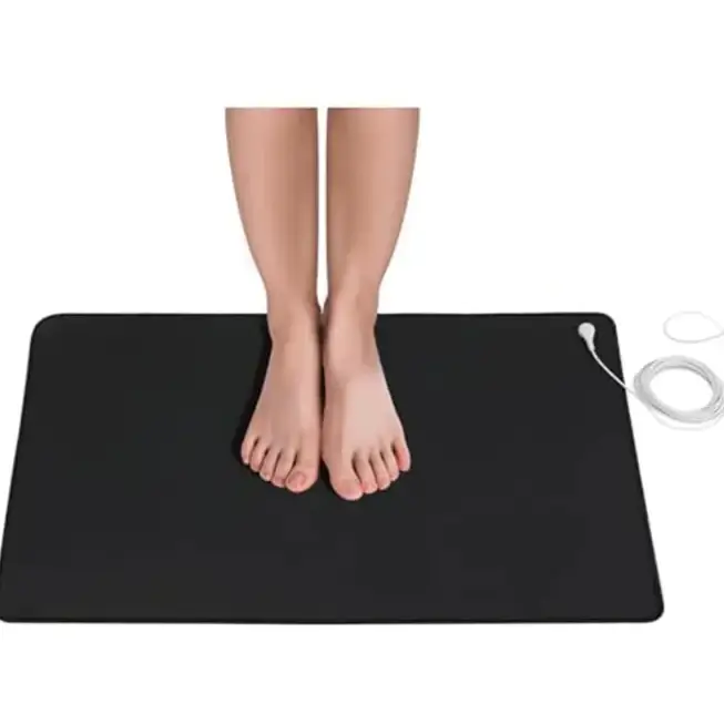Black rectangular electric heating mat with a white power cord and plug.