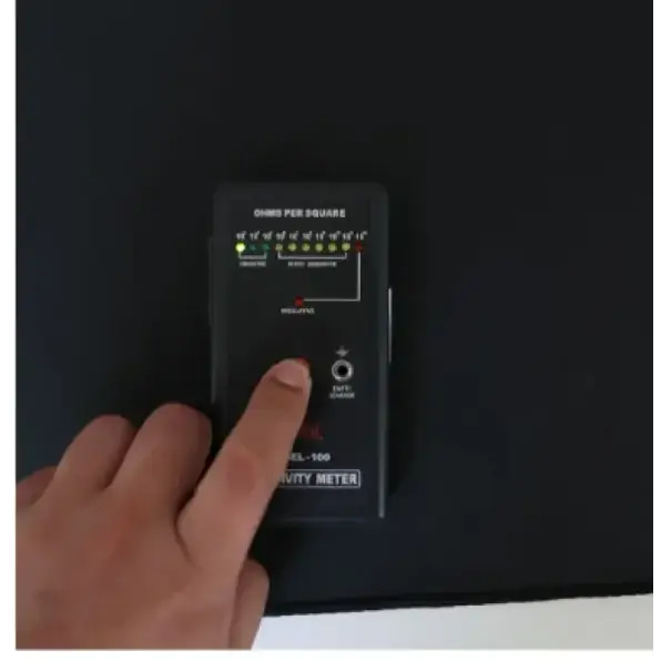 Black rectangular hilland el-100 ohms per square continuity meter with illuminated green and red indicator lights.