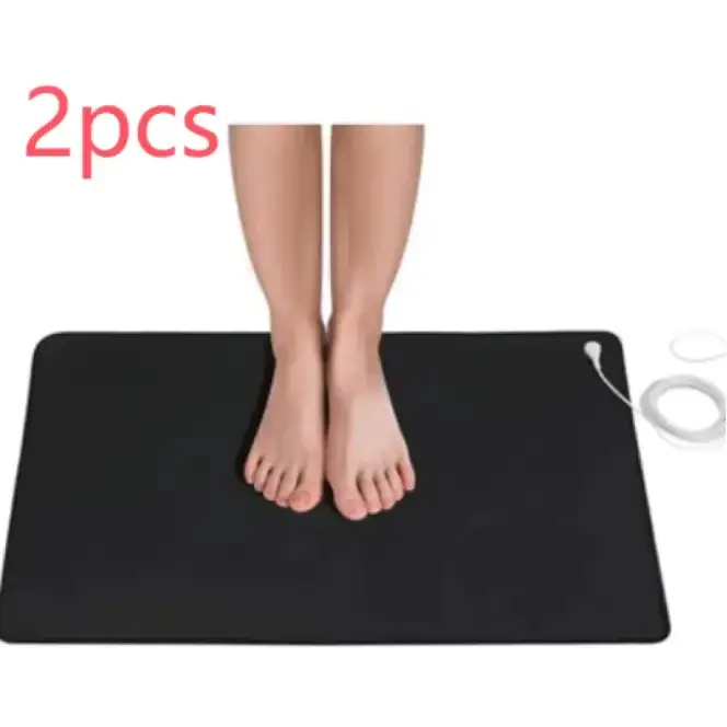 Black rectangular electric heating mat with a white power cord and plug.