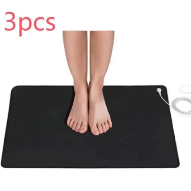 Black rectangular electric heating mat with white power cord and plug