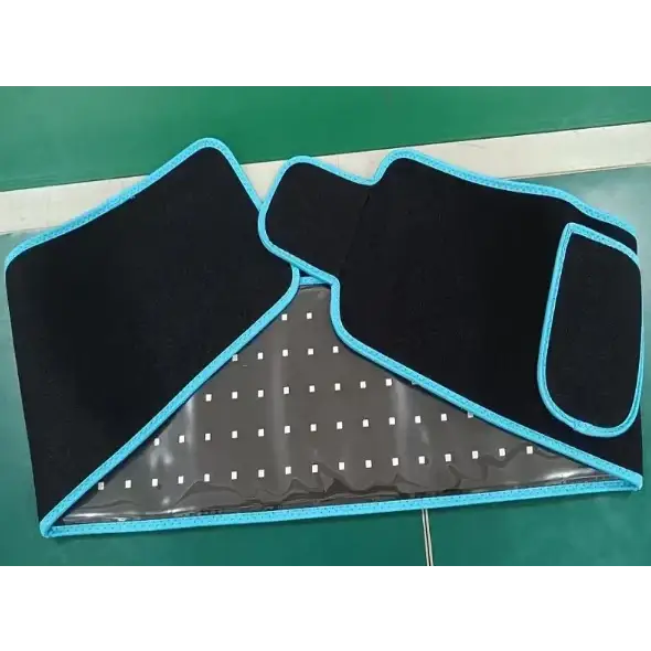 Black and light blue elastic waist support belt with a transparent panel featuring white dot patterns.