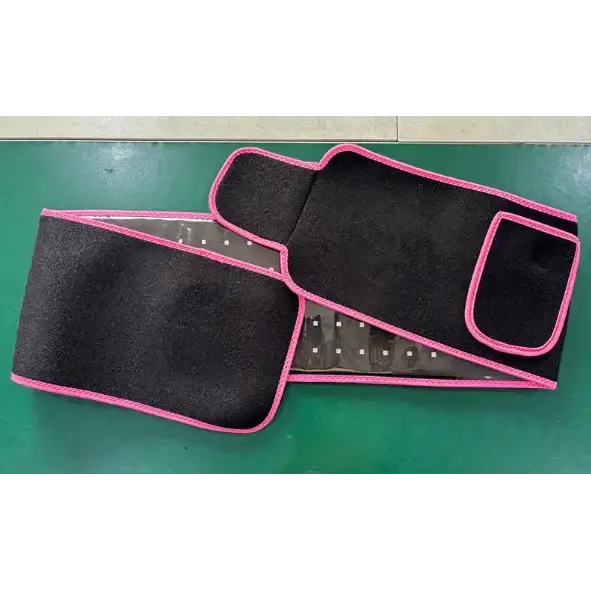 Black waist trainer with pink trim and a transparent panel revealing internal mesh.