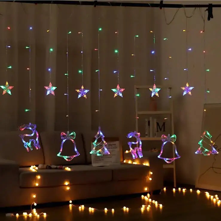 Colorful led string lights with star, reindeer, bell, and christmas tree shapes hang in a festive arrangement.