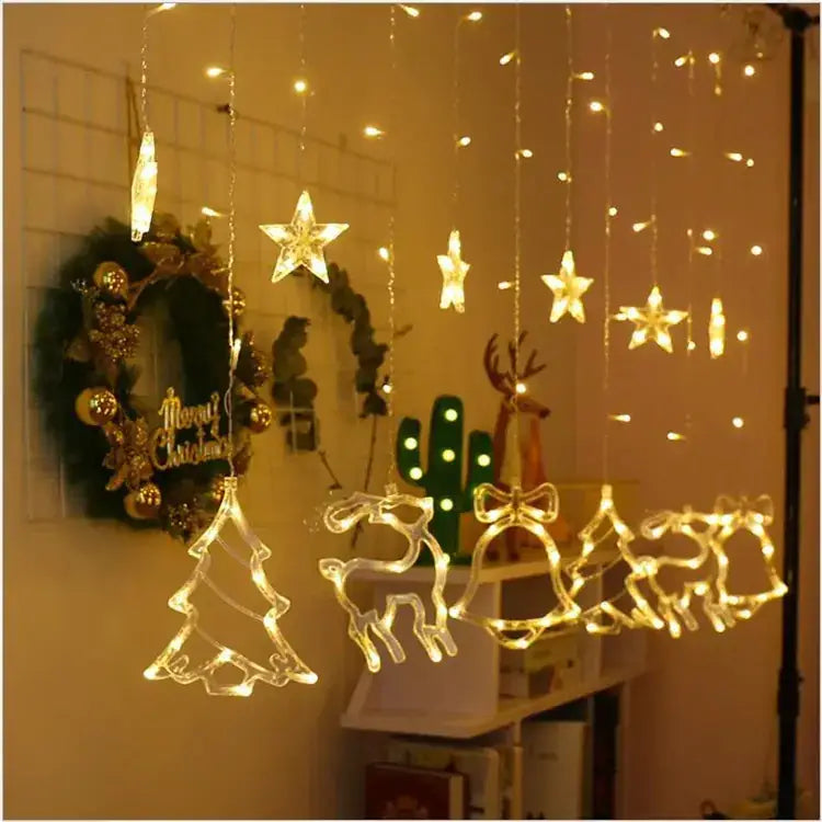 String of warm white led christmas lights featuring illuminated star, reindeer, bell, and tree shapes.