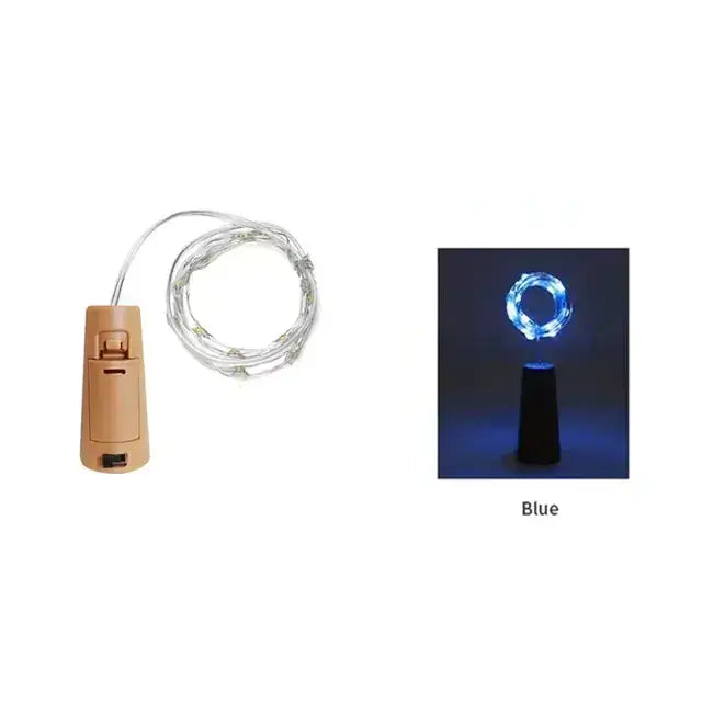 Beige battery-operated led wine cork light with a coiled silver wire and blue illuminated ring.