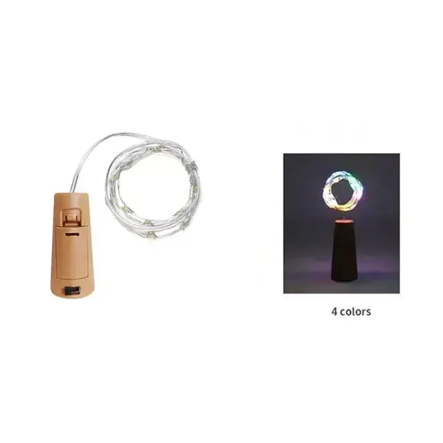 Beige battery-operated led wine cork light with a coiled wire and multicolored glowing effect.