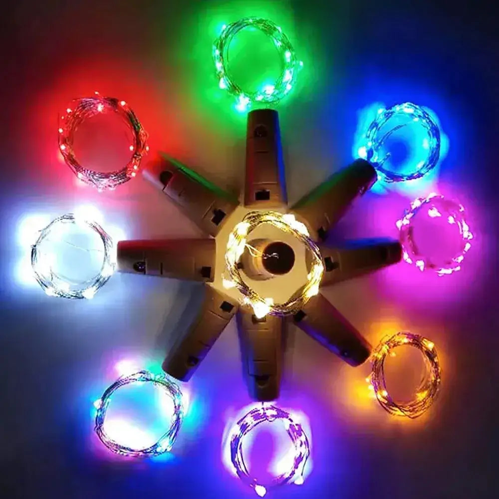 A set of colorful led string lights in various hues including red, green, blue, white, and purple, arranged around a central cardboard hub.