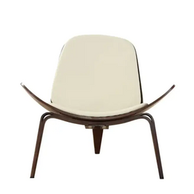 Cream-colored upholstered lounge chair with a sleek, curved dark wood frame and tapered legs.