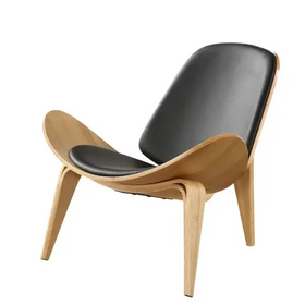Black leather upholstered lounge chair with a sleek, curved wooden frame.