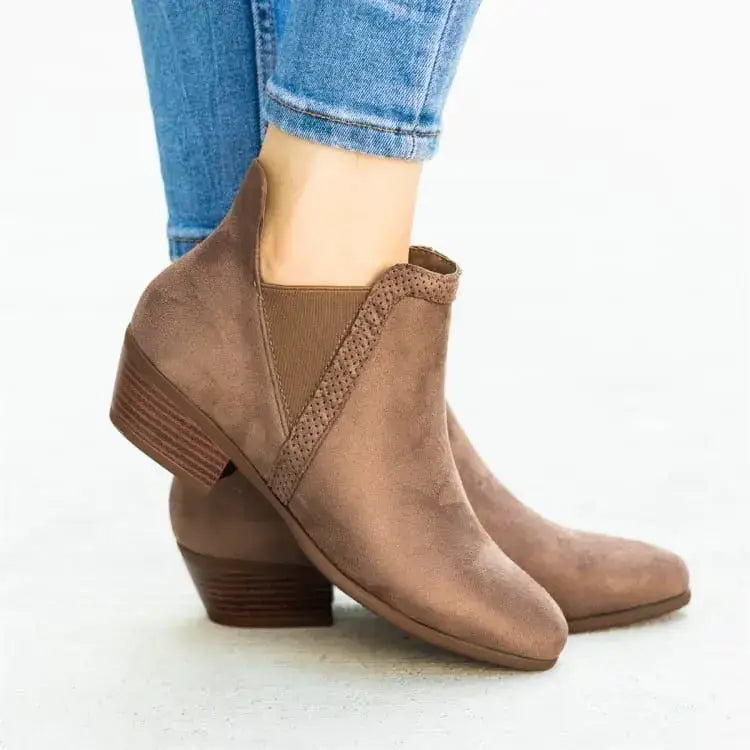 Brown suede ankle boots with a low block heel and elastic side panel.