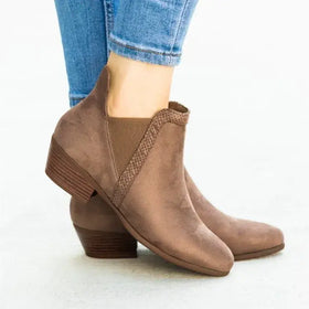Brown suede ankle boots with a low block heel and elastic side panel.