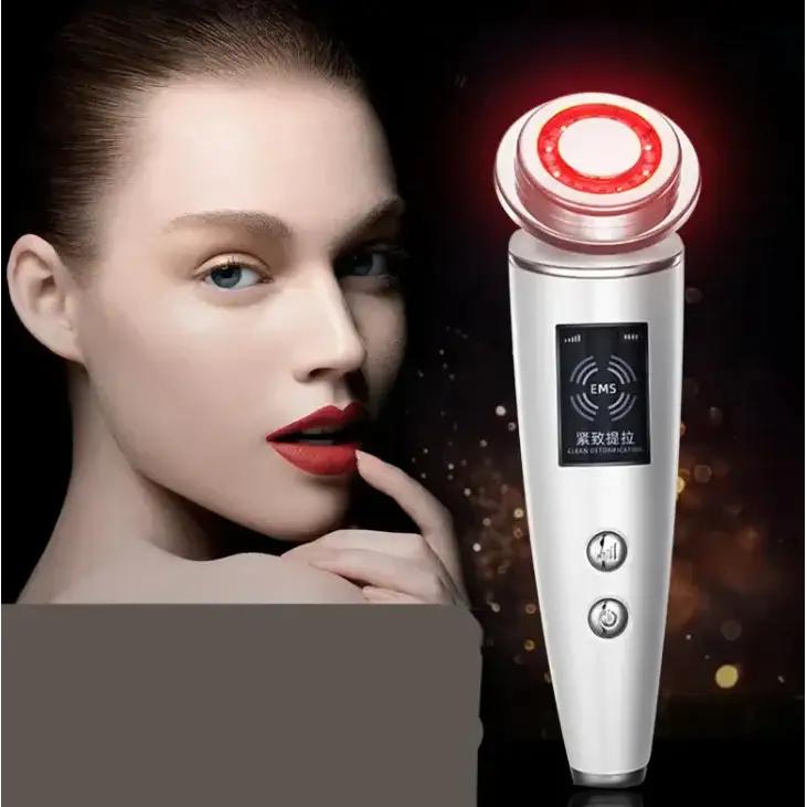Silver handheld facial device with red illuminated circular head and black display panel featuring ’ems’ branding