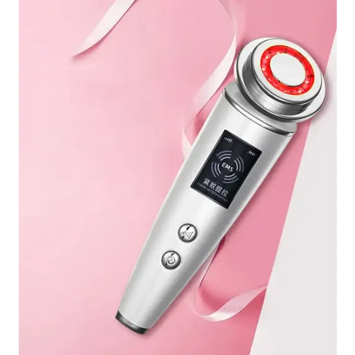 Silver-toned facial device with a circular red led light ring at the tip and two control buttons on its sleek, cylindrical body.