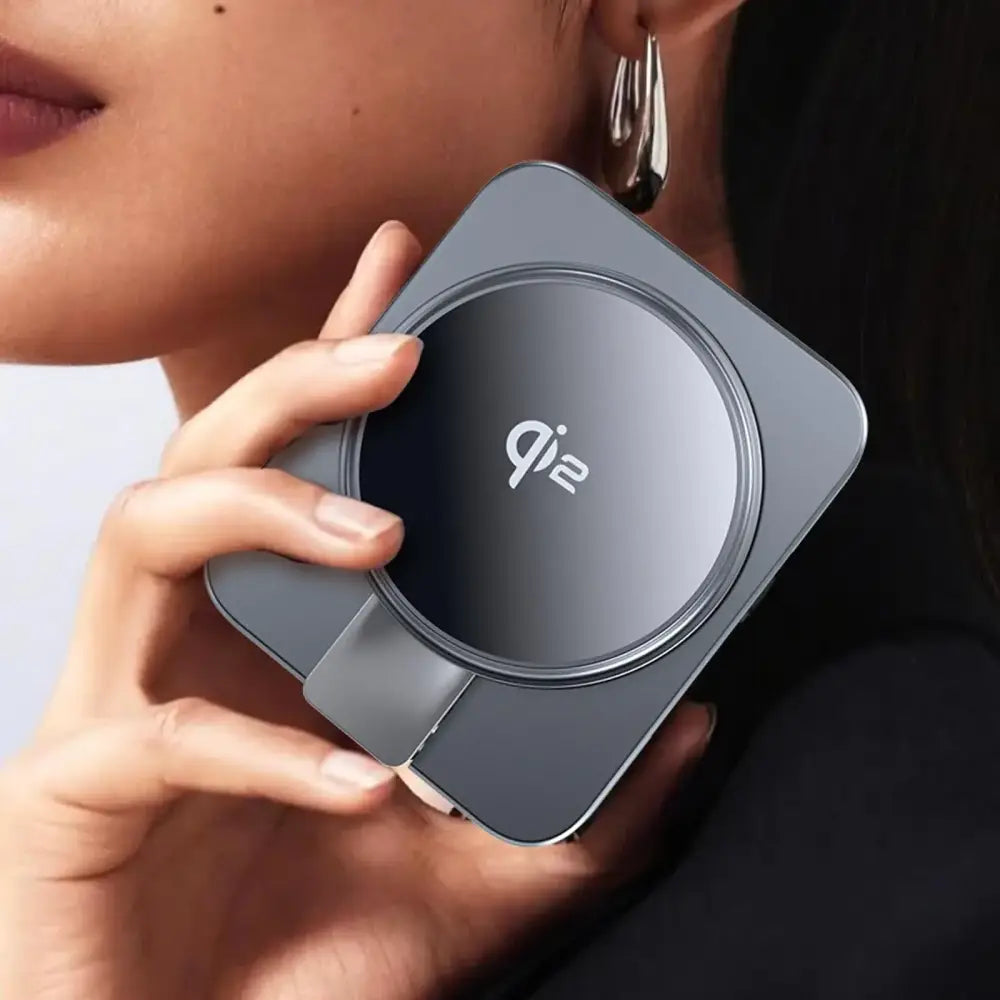 A sleek, matte gray qi2 wireless charger with a circular charging pad and minimalist design.