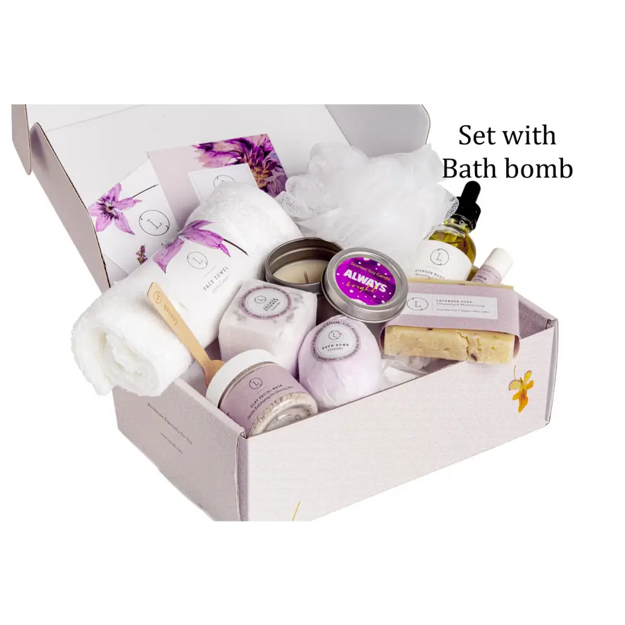 Lavender-scented bath bomb nestled in a gift box with matching purple and white packaging, surrounded by candles, soap bars, and other spa essentials.